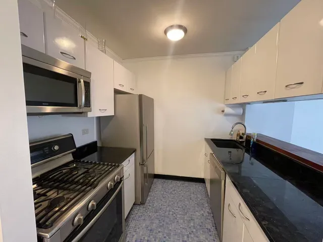 a kitchen with a stove and a microwave