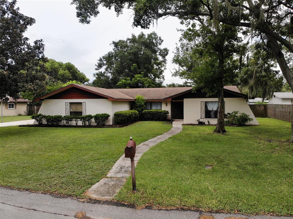 6016 Ridge Drive Lakeland, FL 33813 - Photo 1 of 1 a front view of a house with garden