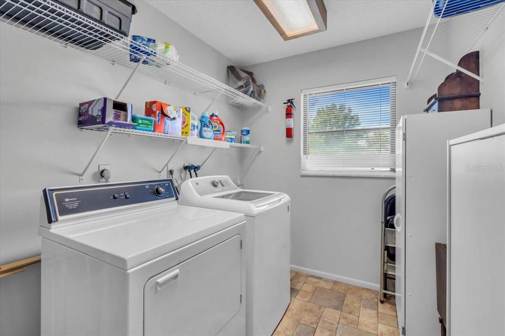 331 Burke Road Venice, FL 34293 - Photo 13 of 29 a utility room with dryer and washer