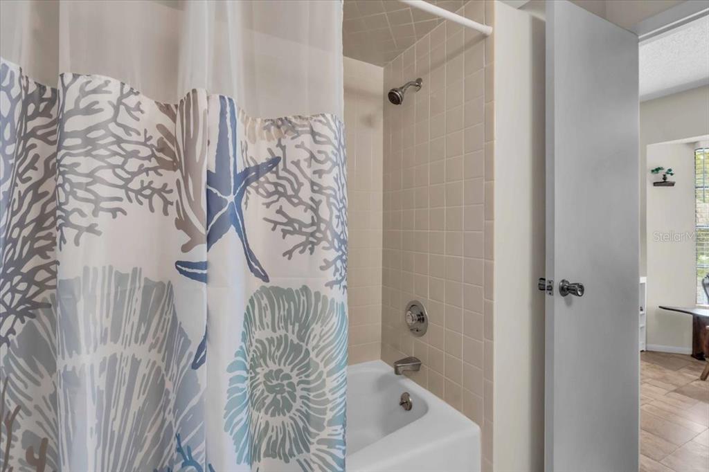 331 Burke Road Venice, FL 34293 - Photo 23 of 29 a bathroom with a bathtub and shower