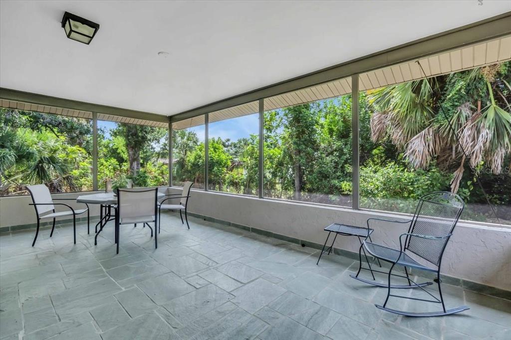 331 Burke Road Venice, FL 34293 - Photo 25 of 29 a outdoor living space with furniture and garden view
