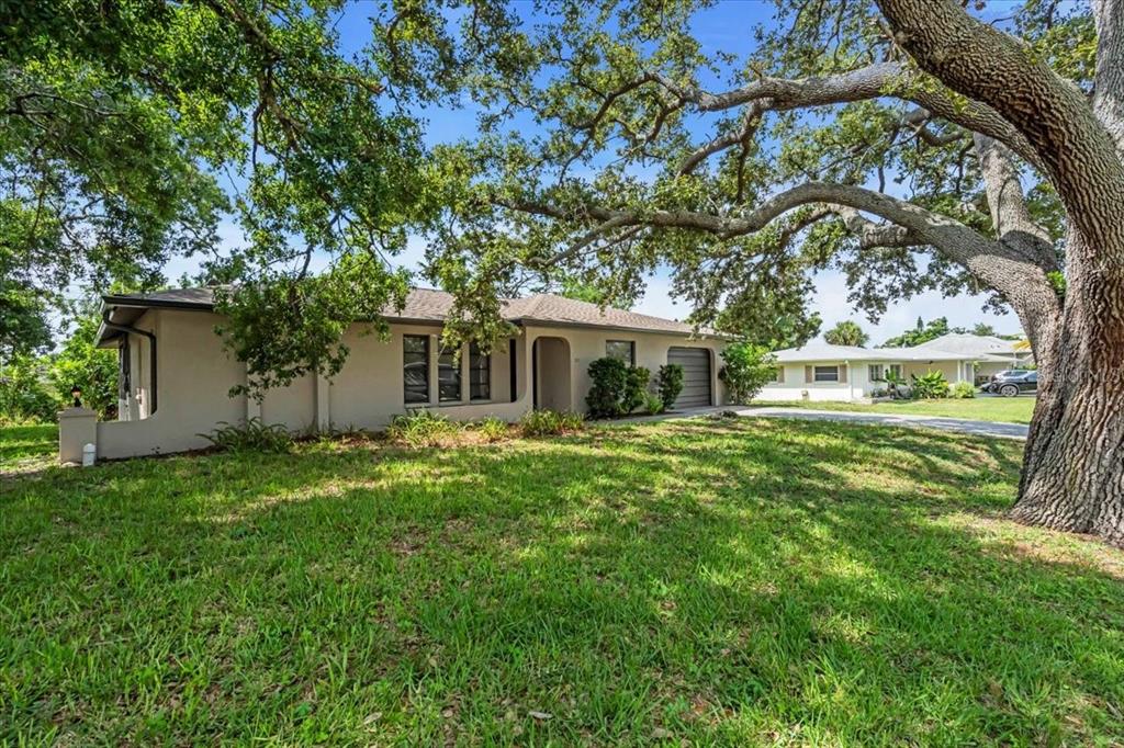 331 Burke Road Venice, FL 34293 - Photo 3 of 29 front view of a house with a yard