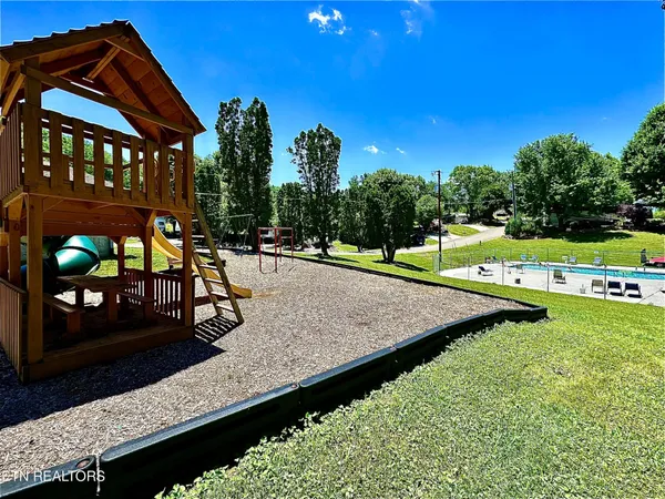 a view of a park with swings