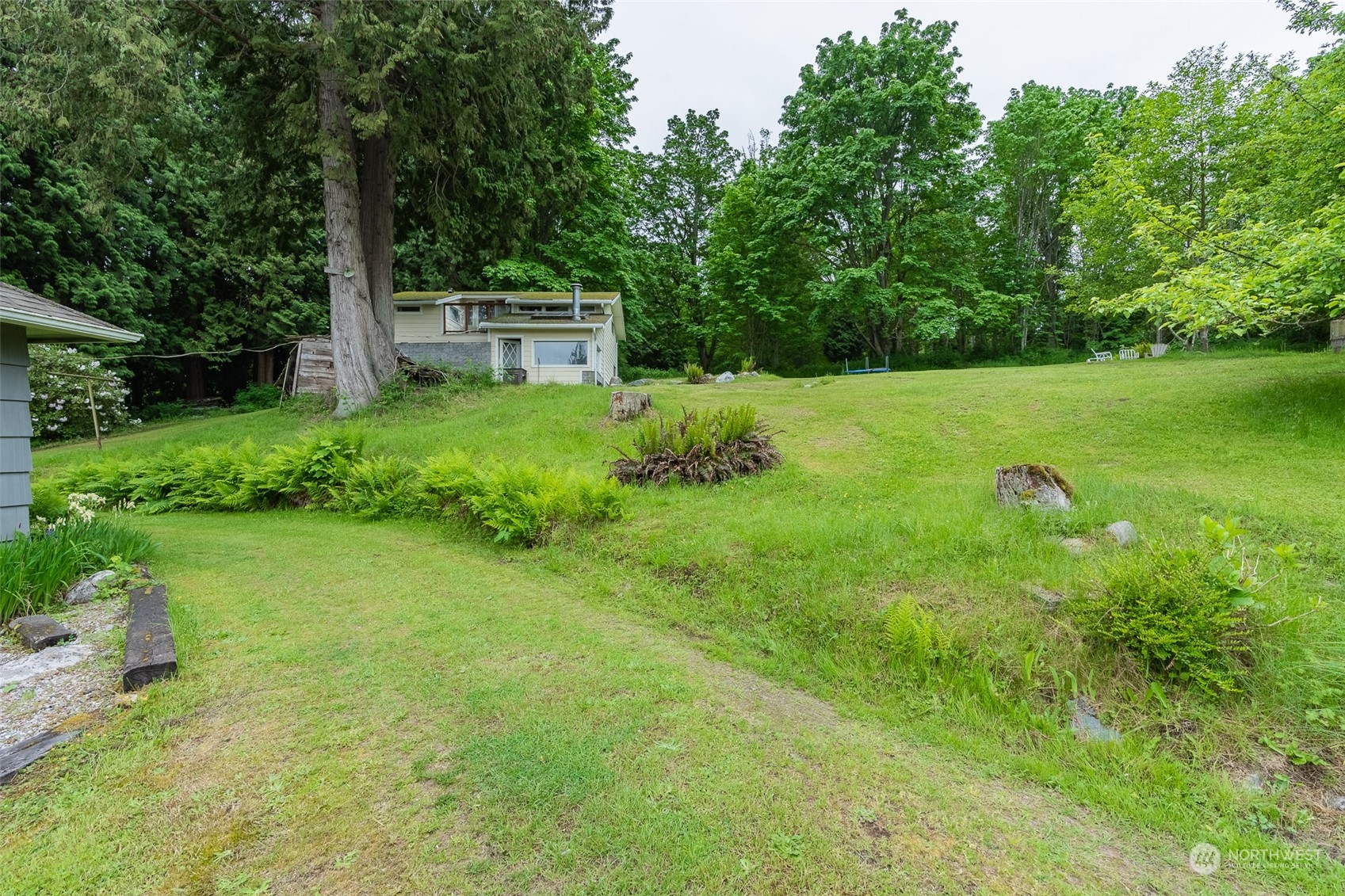 5273 Drayton Harbor Road Blaine, WA 98230 - Photo 12 of 33 a view of a garden with a fountain