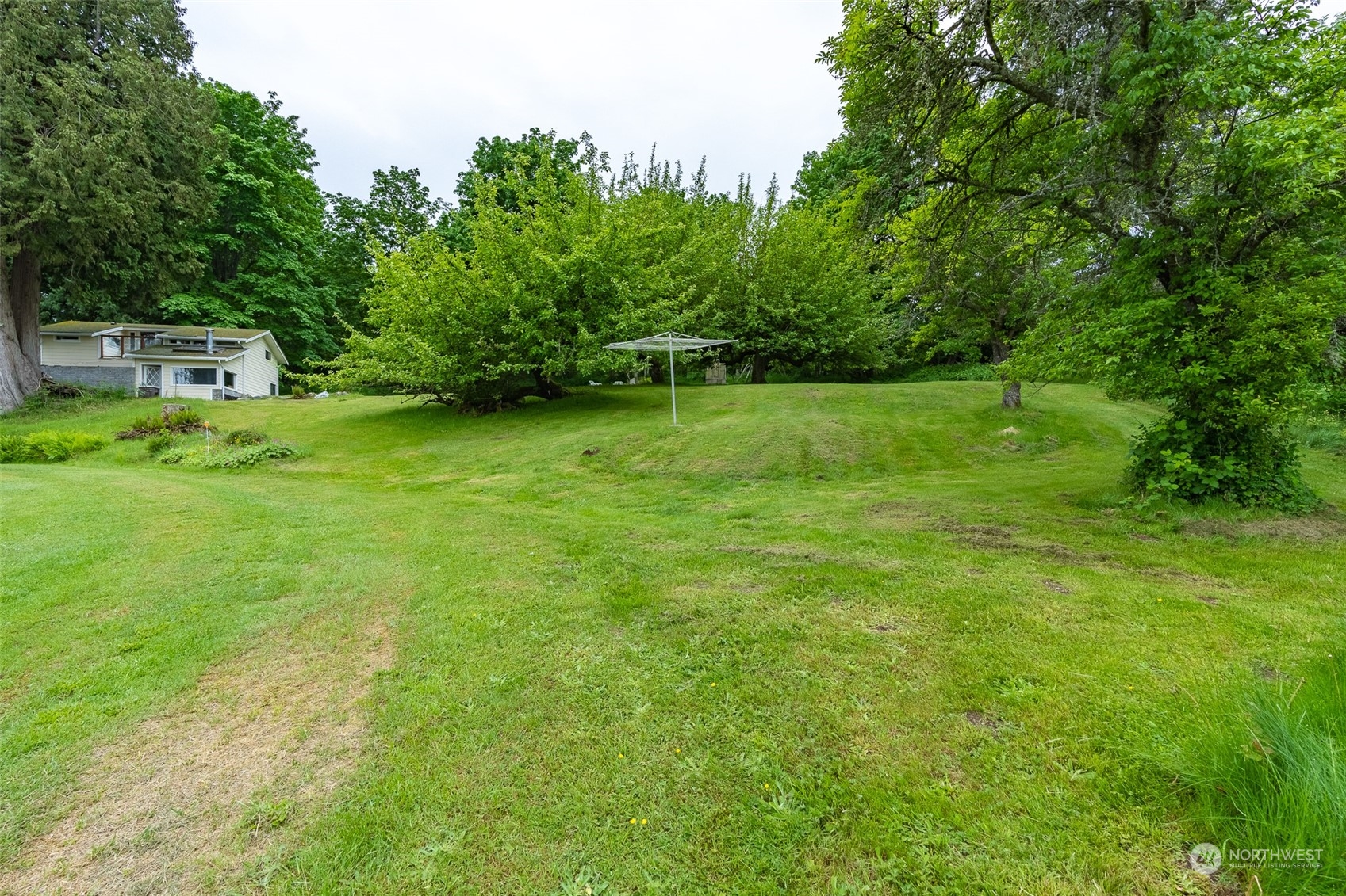 5273 Drayton Harbor Road Blaine, WA 98230 - Photo 14 of 33 a view of a backyard with a garden