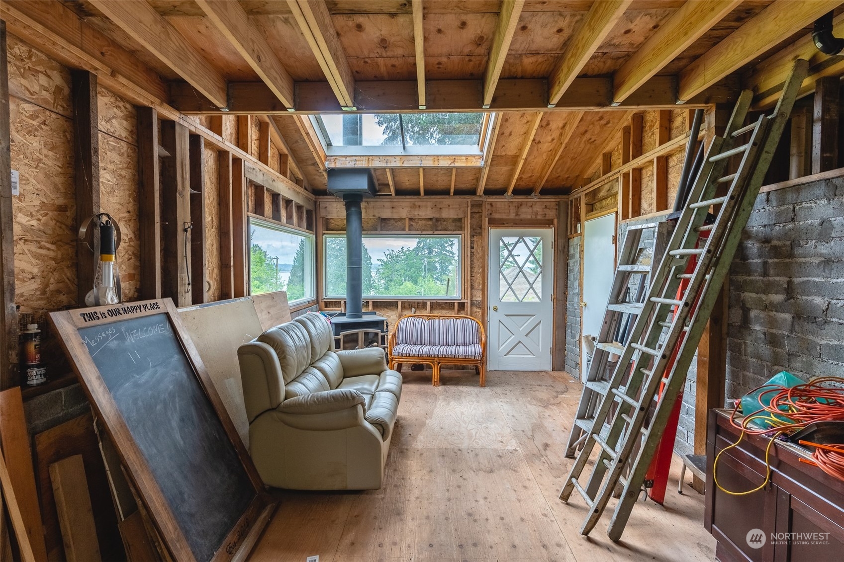 5273 Drayton Harbor Road Blaine, WA 98230 - Photo 21 of 33 a living room with furniture and a floor to ceiling window
