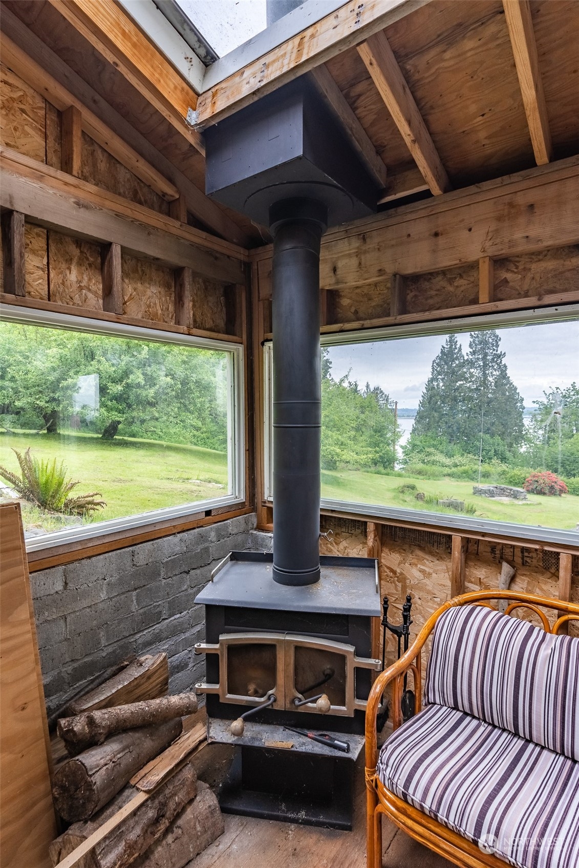 5273 Drayton Harbor Road Blaine, WA 98230 - Photo 27 of 33 a view of a patio with lawn chairs next to a yard