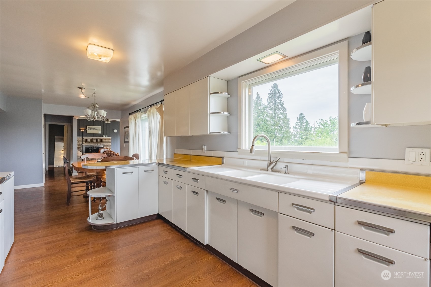5273 Drayton Harbor Road Blaine, WA 98230 - Photo 32 of 33 a kitchen with sink cabinets and wooden floor