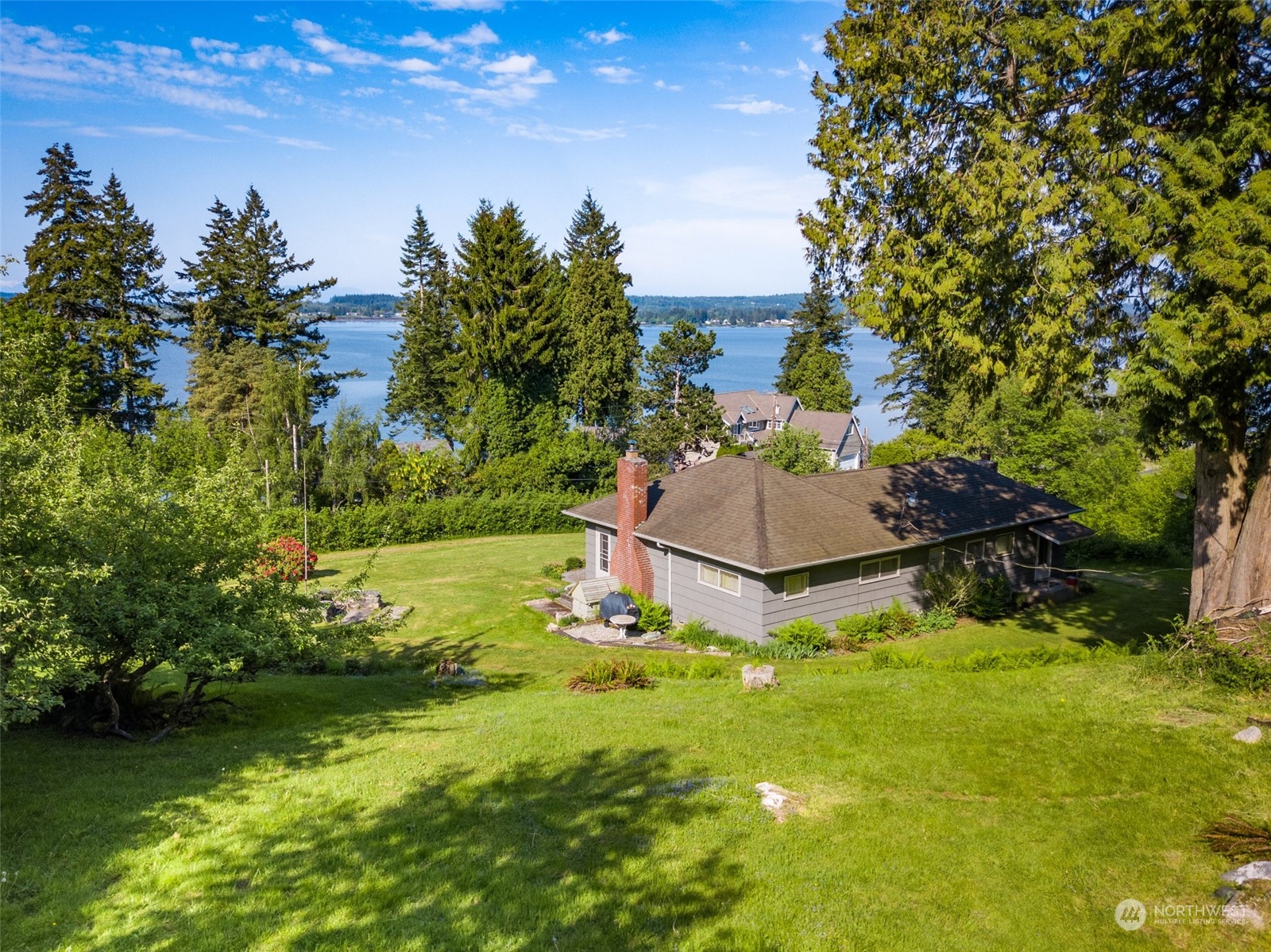 5273 Drayton Harbor Road Blaine, WA 98230 - Photo 8 of 33 a backyard of a house with a yard and outdoor seating