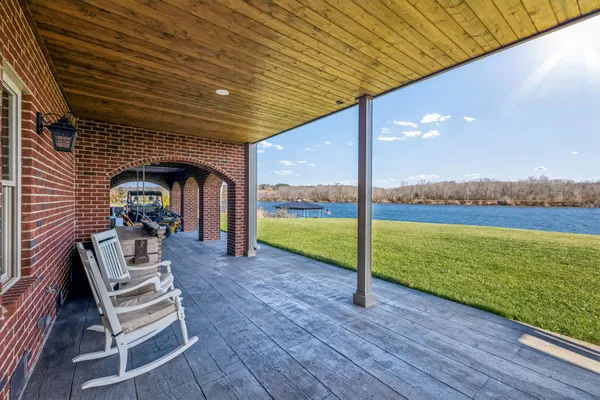 aerial view of a house with a garden and lake view