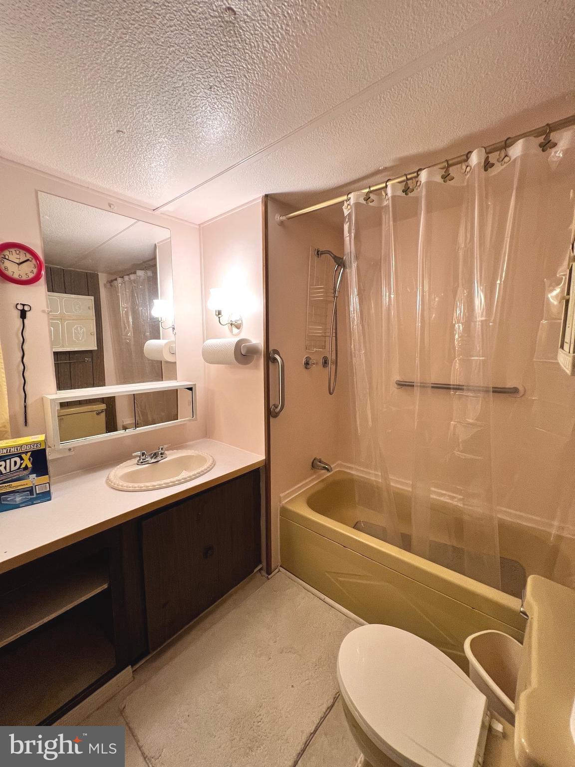 1314 Spring Garden Road Millville, NJ 08332 - Photo 3 of 10 a bathroom with a sink mirror toilet and bathtub