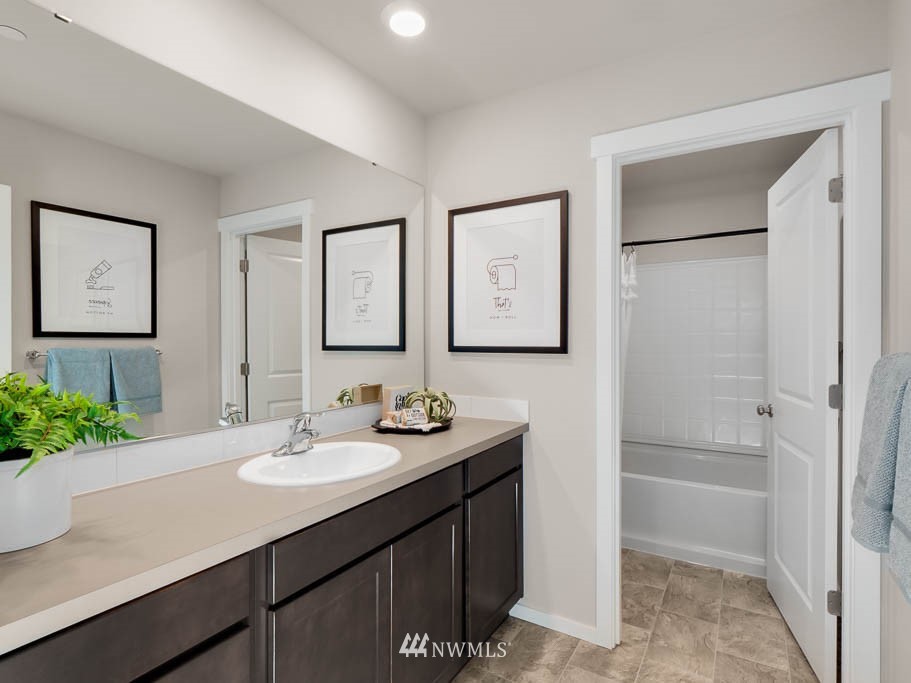 22 181st Street Southeast, Unit 2 Bothell, WA 98012 - Photo 28 of 40 a bathroom with a sink and a mirror