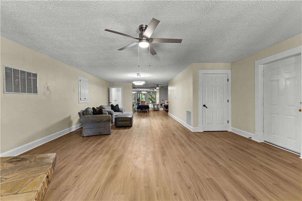 394 Ferrell-Tatum Road LaGrange, GA 30240 - Photo 46 of 68 a view of a livingroom with hardwood floor and a ceiling fan