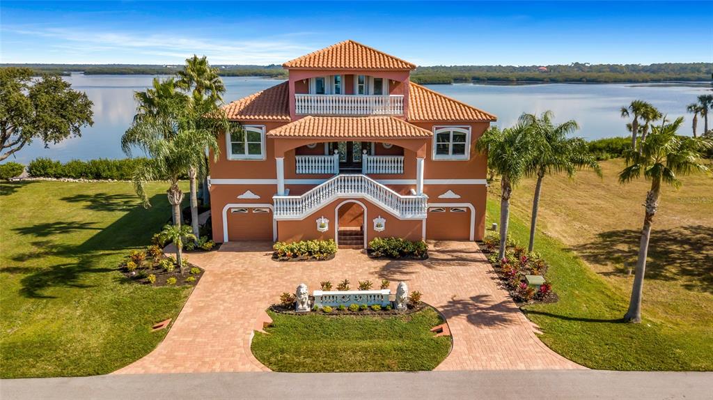 4613 Harborpointe Drive Port Richey, FL 34668 - Photo 1 of 21 a front view of a house with a ocean view