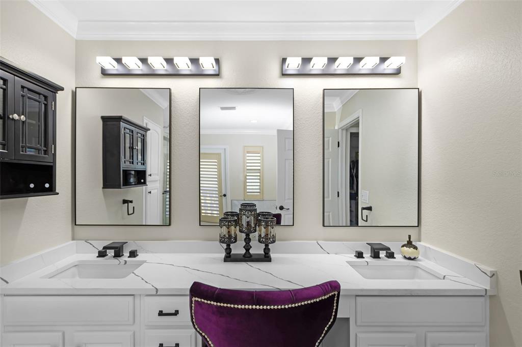 4613 Harborpointe Drive Port Richey, FL 34668 - Photo 13 of 21 a bathroom with double vanity sinks and a mirror