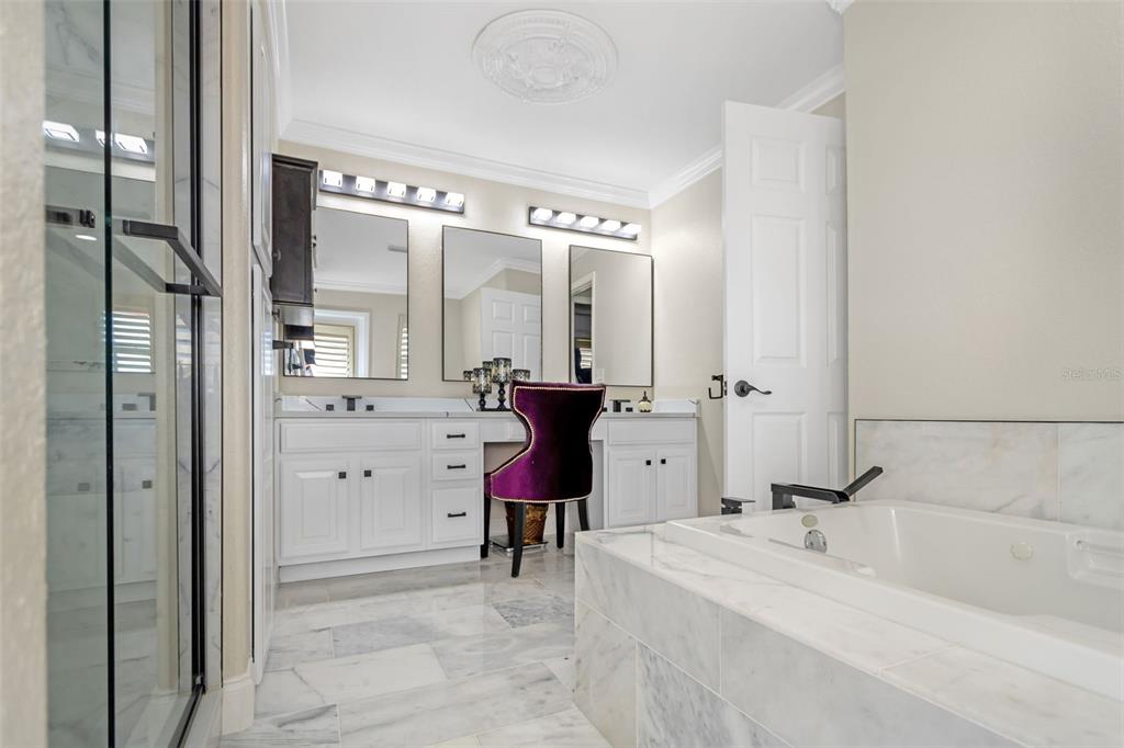 4613 Harborpointe Drive Port Richey, FL 34668 - Photo 14 of 21 a bathroom with a tub sink and mirror