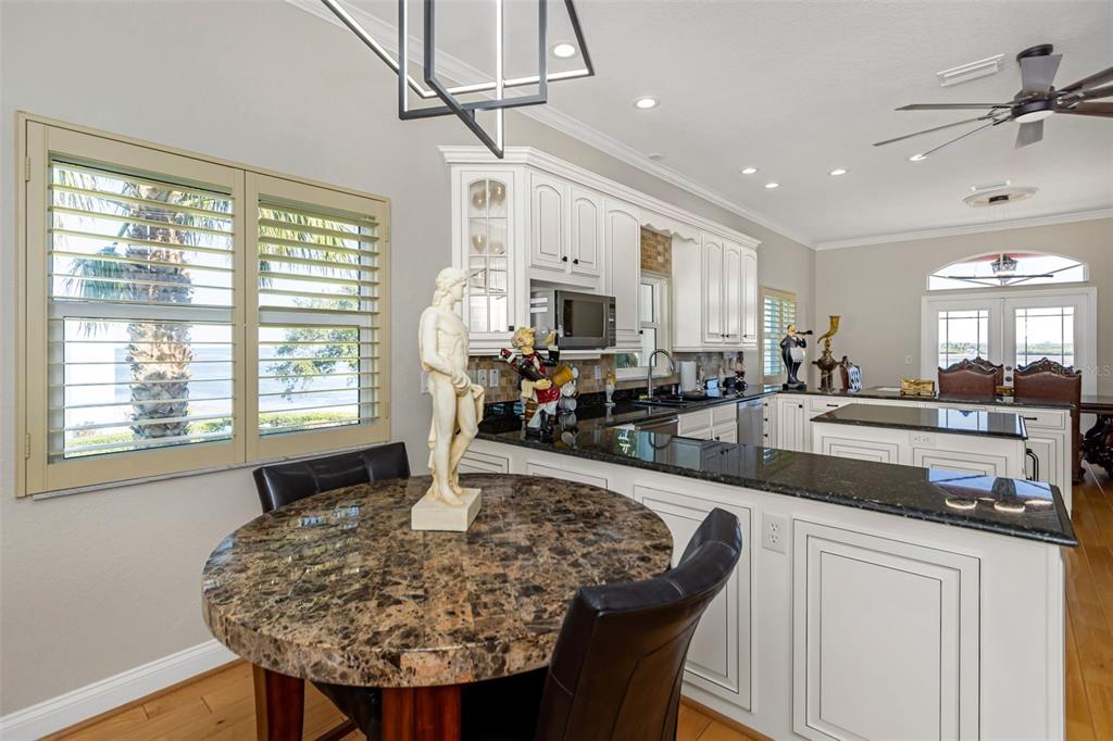 4613 Harborpointe Drive Port Richey, FL 34668 - Photo 20 of 21 a kitchen with sink refrigerator and large window
