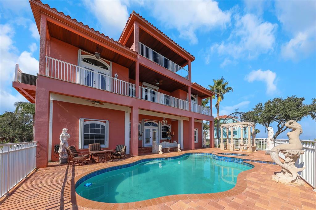 4613 Harborpointe Drive Port Richey, FL 34668 - Photo 2 of 21 a view of a building with a swimming pool