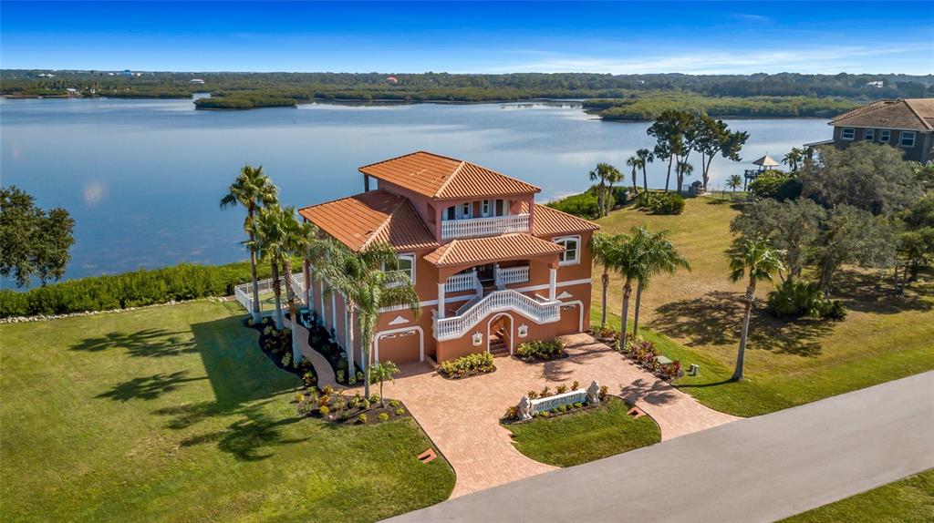 4613 Harborpointe Drive Port Richey, FL 34668 - Photo 5 of 21 an aerial view of a house with outdoor space and lake view