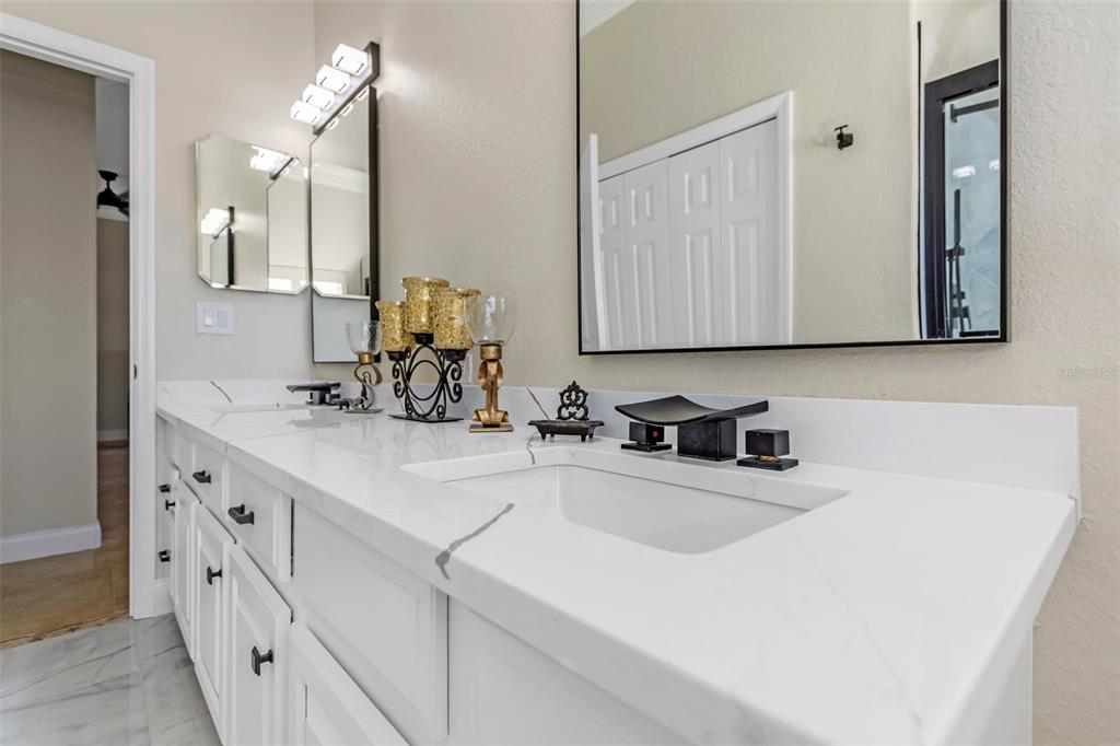 4613 Harborpointe Drive Port Richey, FL 34668 - Photo 10 of 21 a kitchen with sink a microwave and cabinets