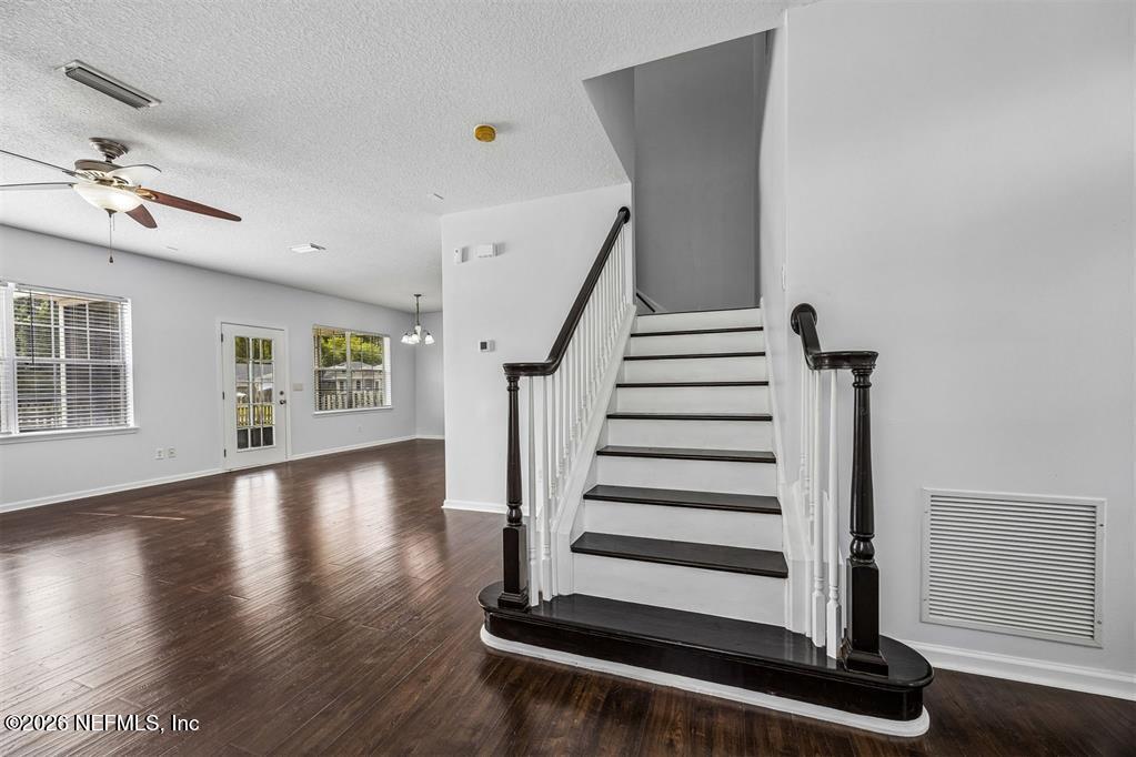 96204 Coral Reef Road Yulee, FL 32097 - Photo 20 of 40 a view of entryway and hall with wooden floor