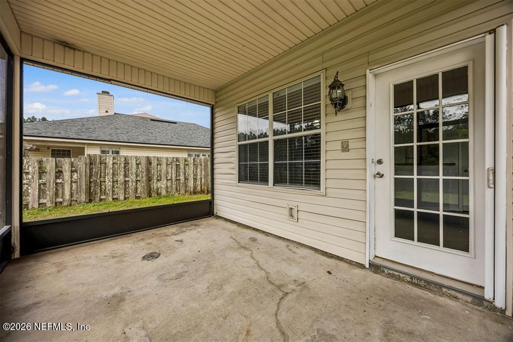 96204 Coral Reef Road Yulee, FL 32097 - Photo 34 of 40 a view of front door with outdoor space