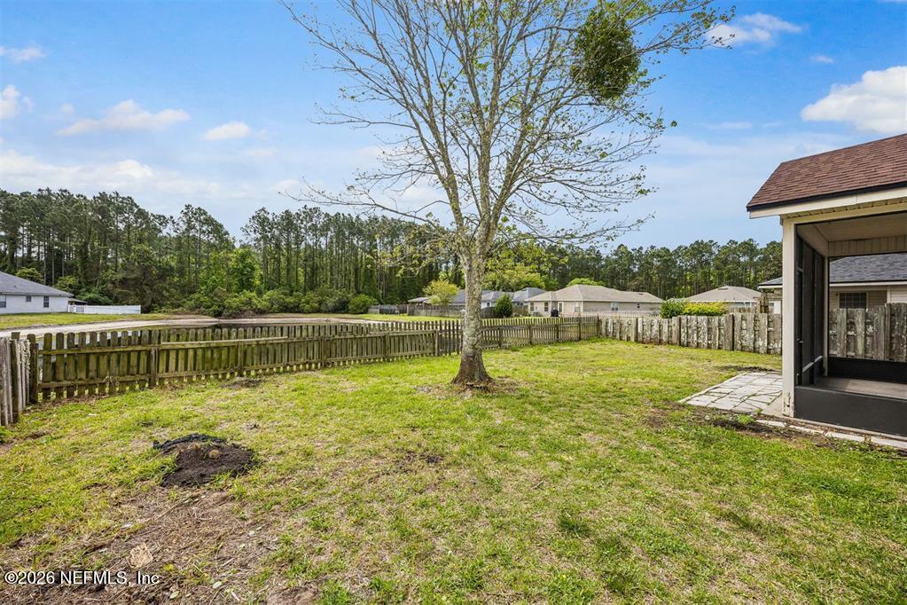 96204 Coral Reef Road Yulee, FL 32097 - Photo 36 of 40 a view of a house with a yard