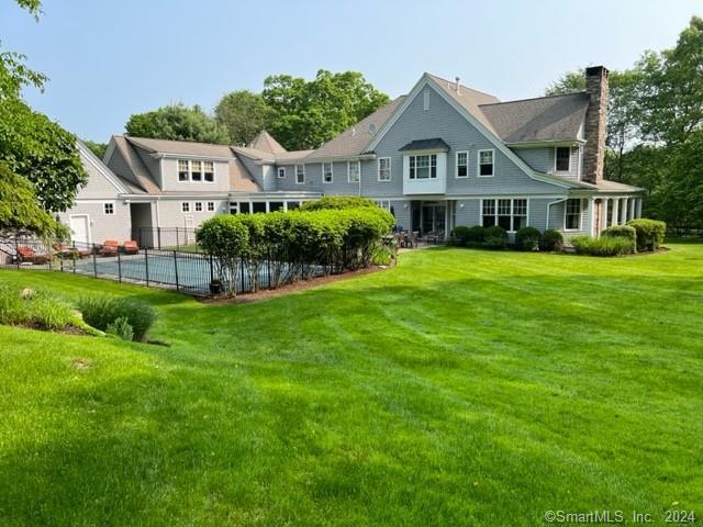 Large level back yard ideal for playing tag, soccer, badminton, croquet, etc. all summer long