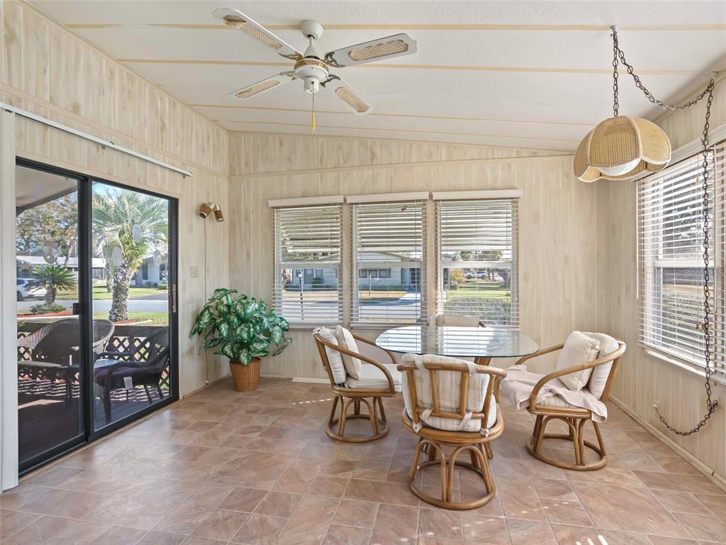 1102 Dustin Drive The Villages, FL 32159 - Photo 16 of 38 a view of a dining room with furniture window and outside view