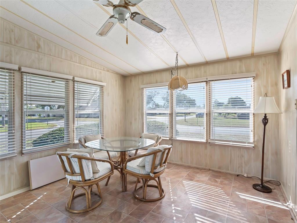1102 Dustin Drive The Villages, FL 32159 - Photo 17 of 38 a dining room with furniture and window