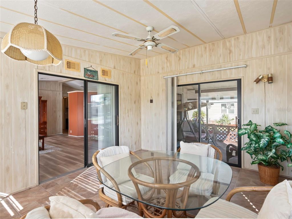 1102 Dustin Drive The Villages, FL 32159 - Photo 18 of 38 a living room with furniture and a chandelier