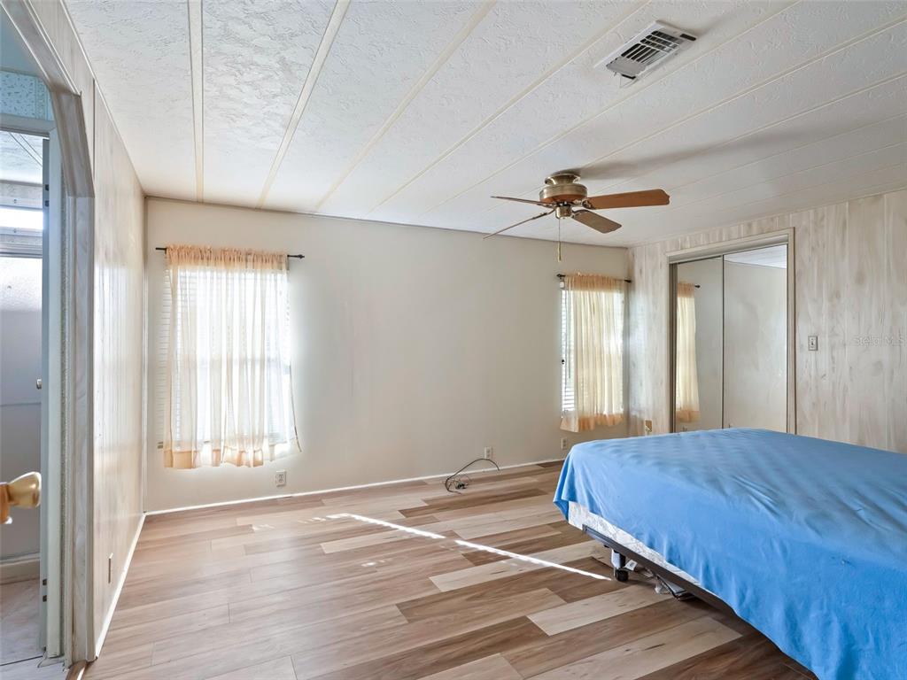 1102 Dustin Drive The Villages, FL 32159 - Photo 20 of 38 a bedroom with a bed and a window