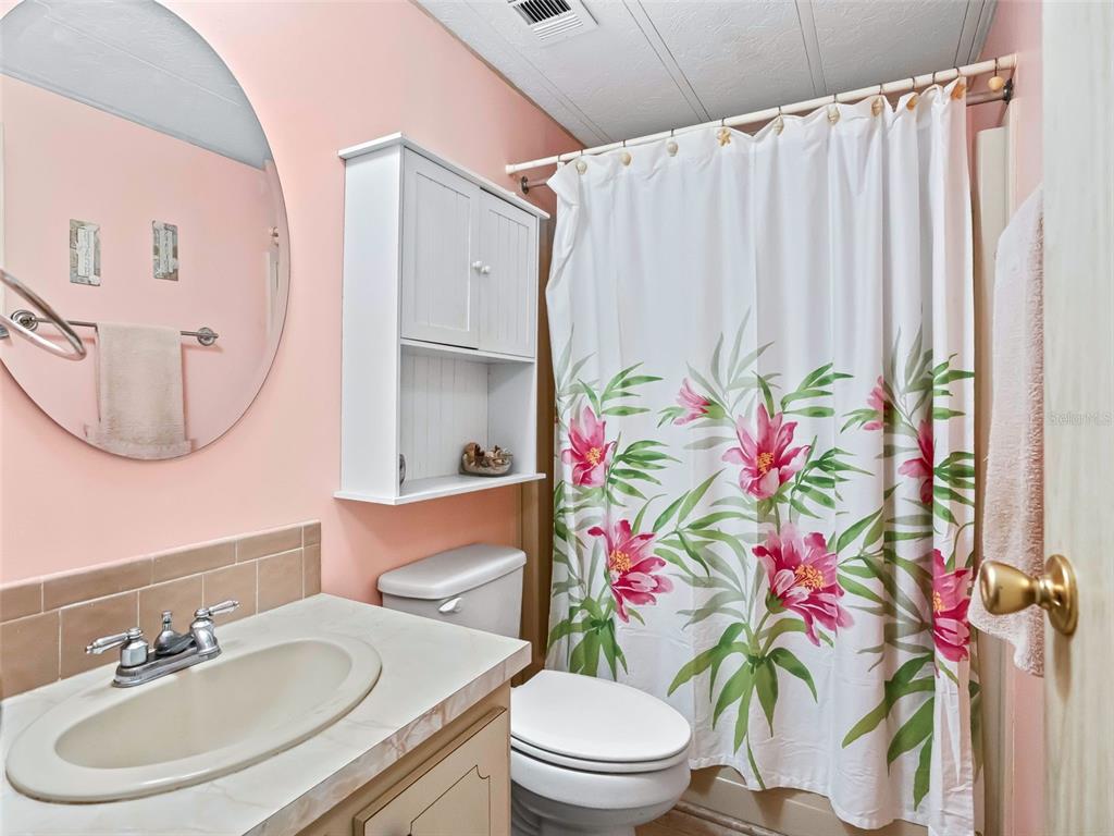1102 Dustin Drive The Villages, FL 32159 - Photo 26 of 38 a bathroom with a sink toilet and shower