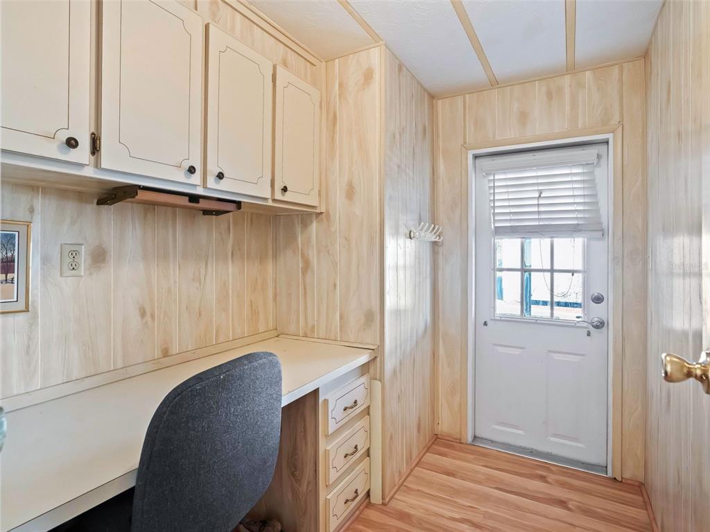 1102 Dustin Drive The Villages, FL 32159 - Photo 27 of 38 a kitchen with a sink and cabinets