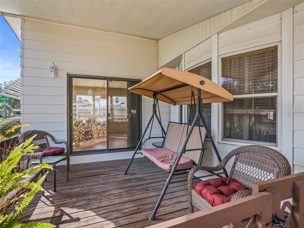 1102 Dustin Drive The Villages, FL 32159 - Photo 3 of 38 a ocean view with sitting space and garden