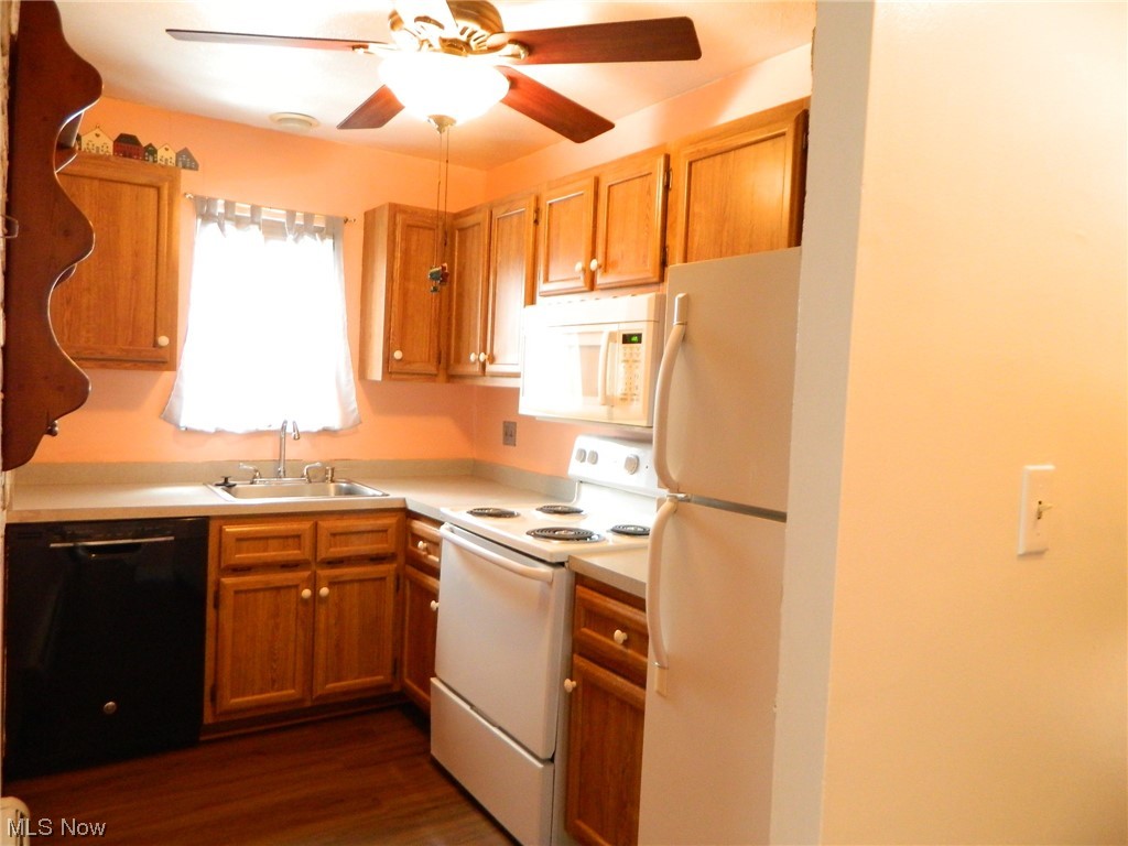 10744 Valley View Road, Unit B8 Northfield, OH 44067 - Photo 4 of 15 Invitingly appointed kitchen with nice counter area. Built-in dishwasher & microwave. Includes the electric/newer range and refrigerator.
