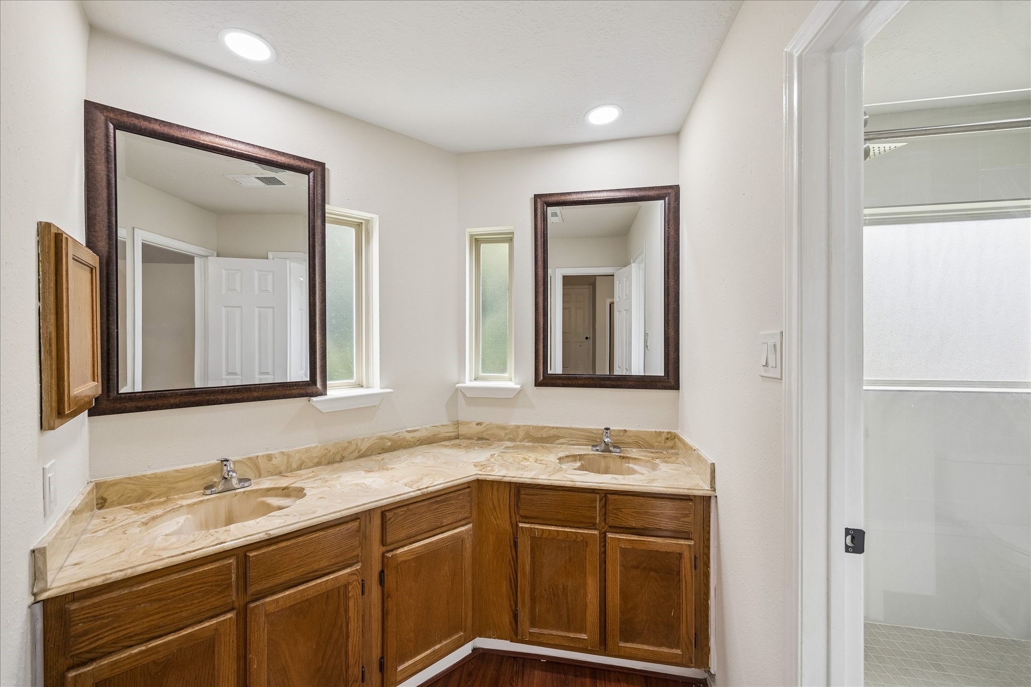 10411 Goodrum Road Houston, TX 77041 - Photo 17 of 25 Primary bathroom with dual sinks and separate shower