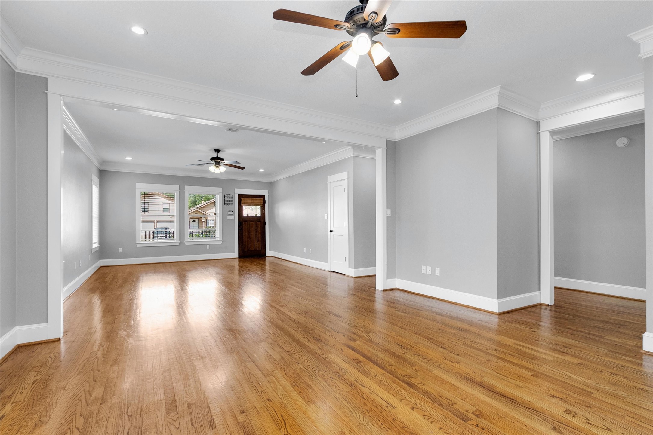 304 Vincent Street Houston, TX 77009 - Photo 10 of 36 a view of an empty room with window and wooden floor