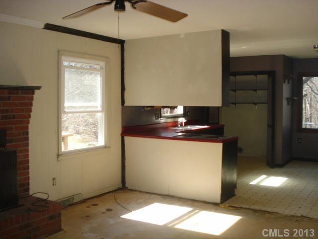 345 Pine Valley Road Salisbury, NC 28147 - Photo 4 of 9 a view of an empty room with window and wooden floor