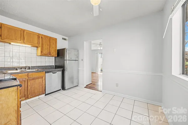 a kitchen with a sink cabinets and appliances