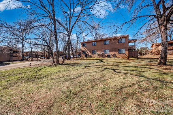a view of a yard with table and chairs