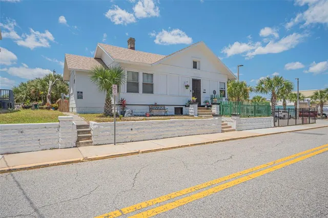 a view of a house with a swimming pool and a outdoor space