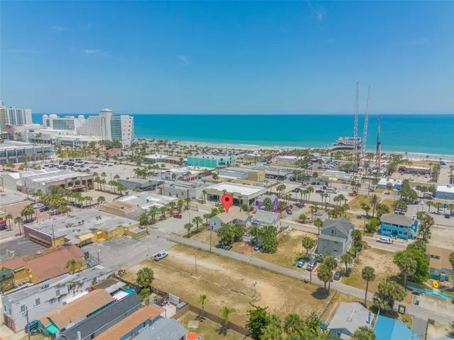 an aerial view of residential houses with outdoor space
