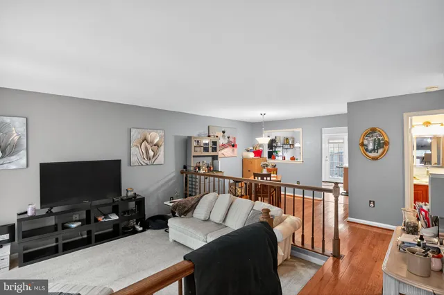 a bedroom with furniture and a flat screen tv