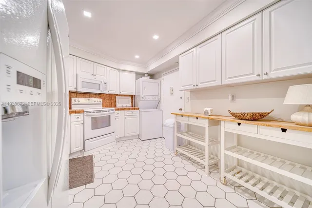 a bathroom with a granite countertop sink a toilet a mirror and shower
