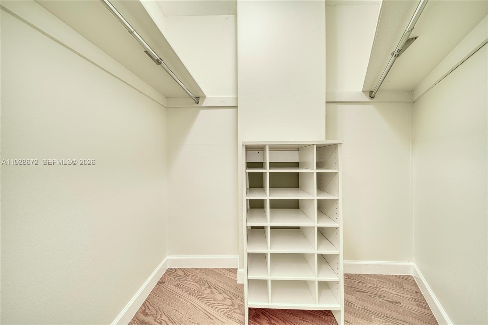 1111 Crandon Boulevard, Unit C404 Key Biscayne, FL 33149 - Photo 20 of 44 a view of closet area with empty racks