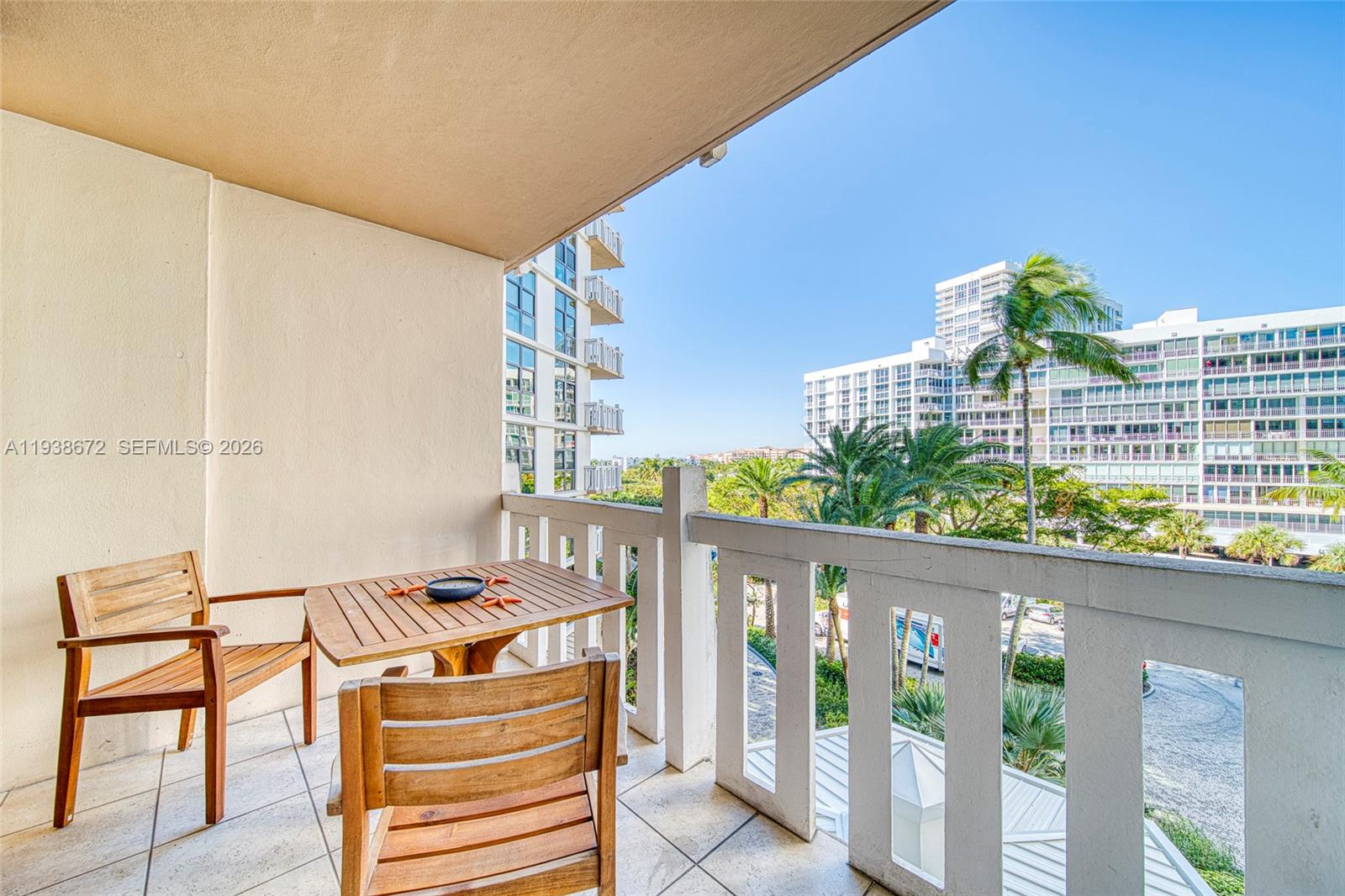 1111 Crandon Boulevard, Unit C404 Key Biscayne, FL 33149 - Photo 22 of 44 a balcony view with couple of chairs