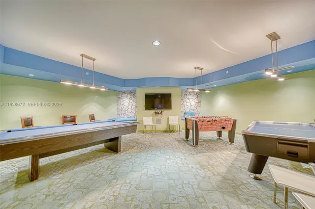 a view of tall trees with a palm tree