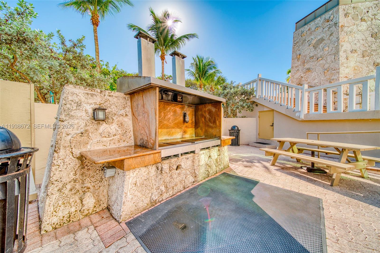 1111 Crandon Boulevard, Unit C404 Key Biscayne, FL 33149 - Photo 39 of 44 a view of swimming pool with outdoor seating