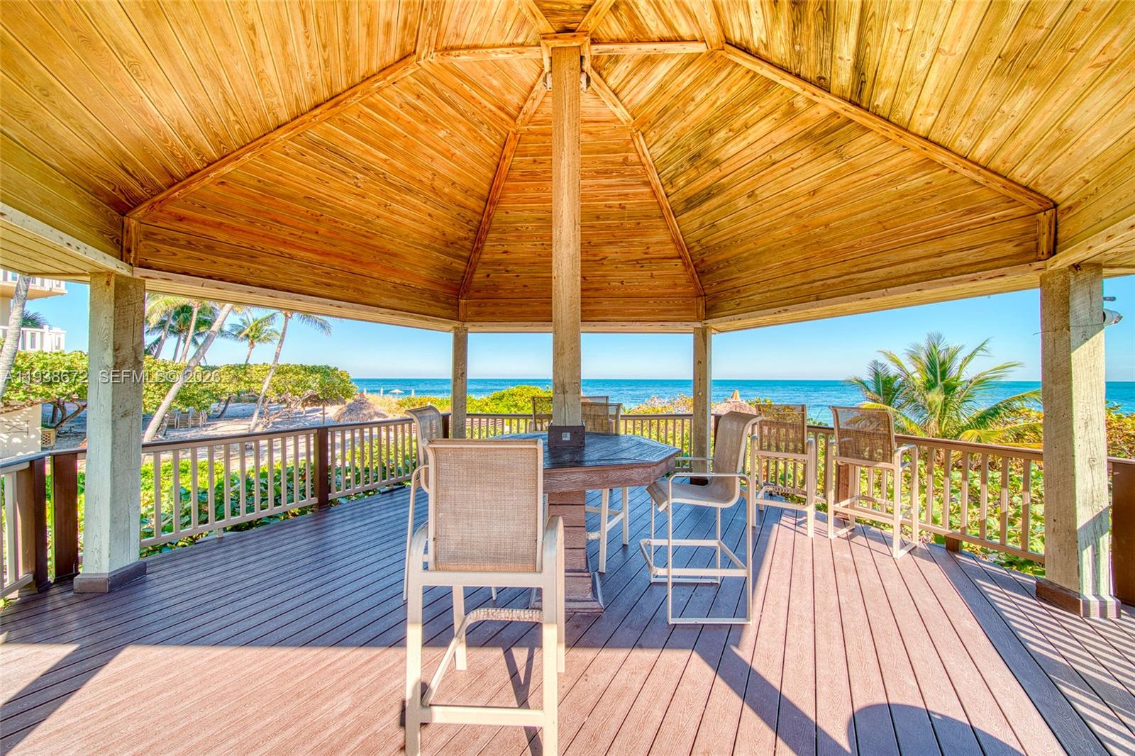 1111 Crandon Boulevard, Unit C404 Key Biscayne, FL 33149 - Photo 40 of 44 a view of a swimming pool with outdoor seating